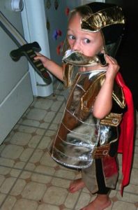 A child in toy Roman armor