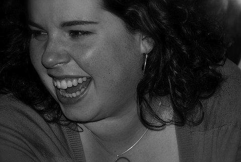 A woman happily laughing