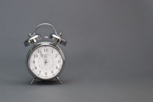 A clock with a gray background