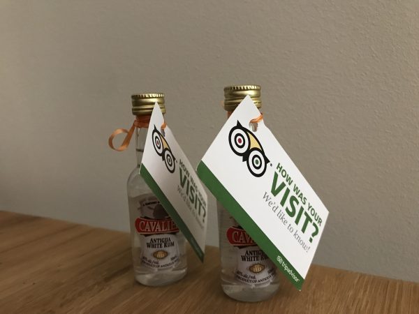Alcohol shooters with a card to rate someones stay