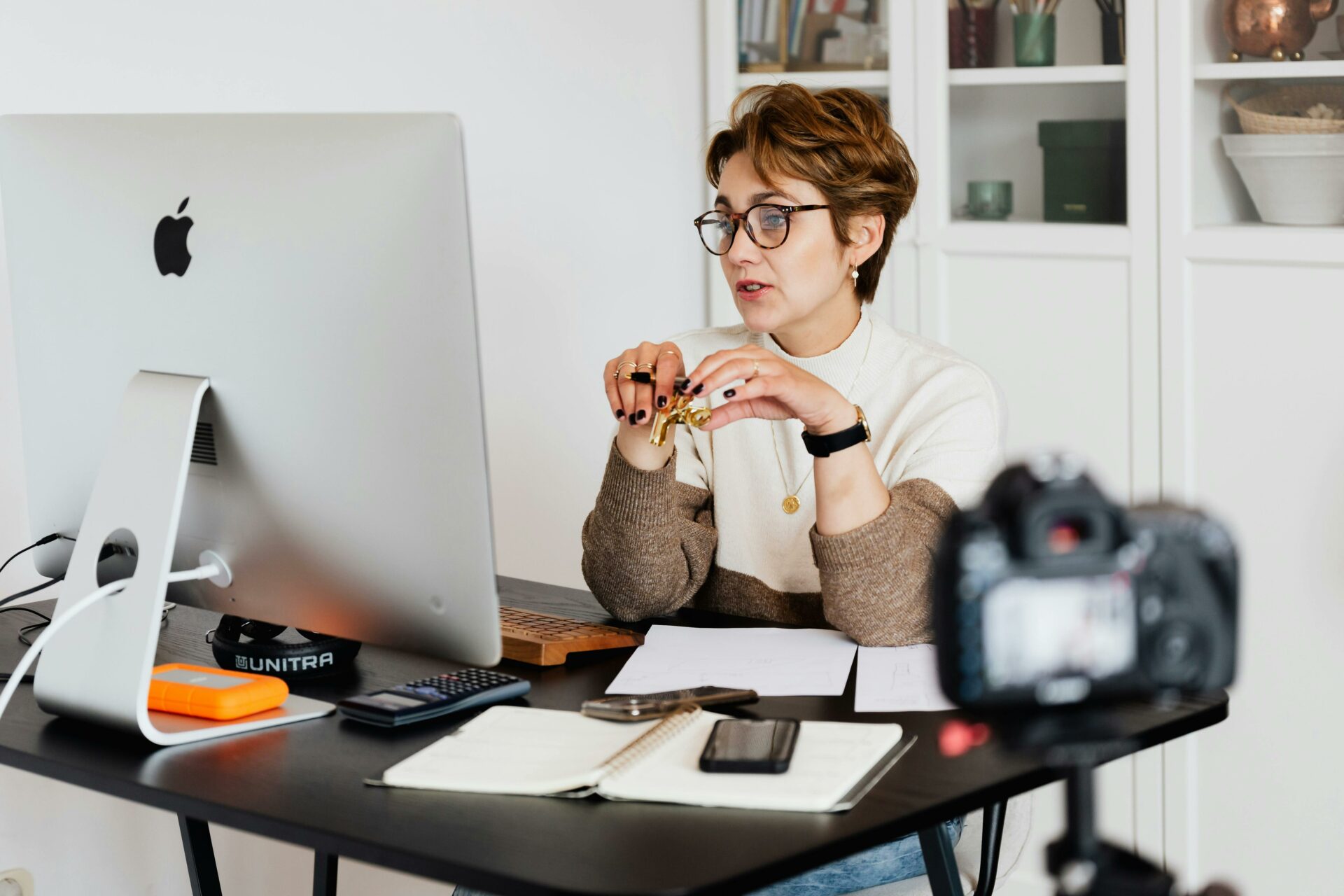 A female consultant being recorded while sitting on a video call. 